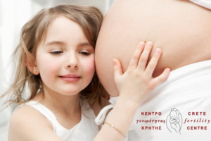 crete fertility centre ad: a girl holding her pregnant's mother belly